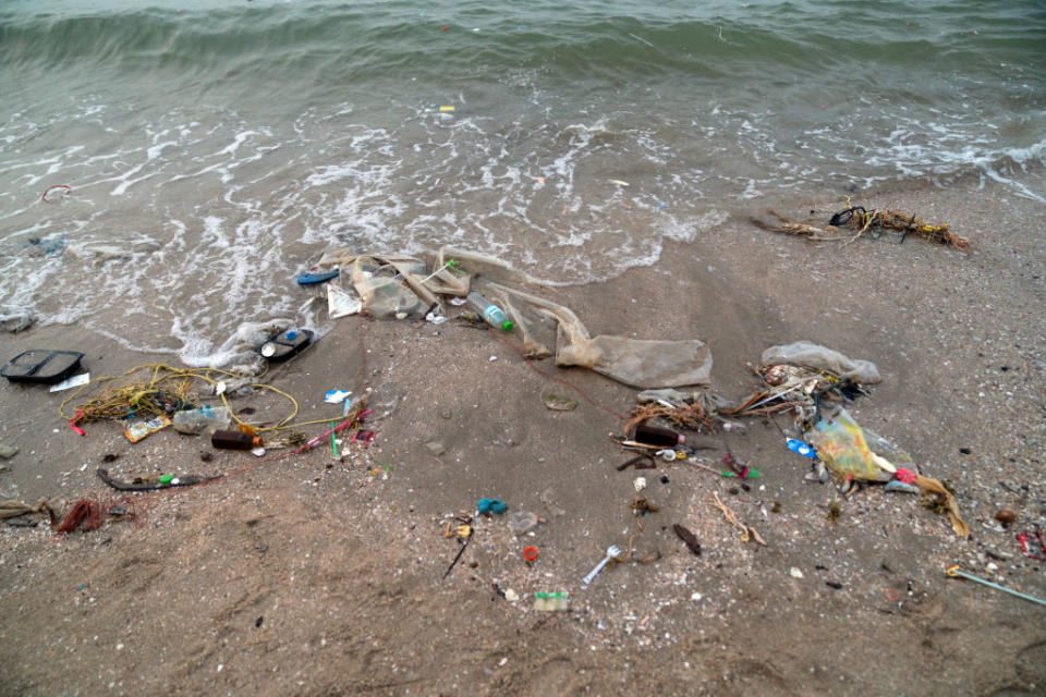 Trash sits along the shore at Bangsaen beach in Chon Buri, Thailand, on Sunday, Jan. 19, 2020. Thailand's love of plastic bags helped make it theÂ sixth-worstÂ maritime polluter. The country generates more than 5,000 metric tons of plastic trash a day, three-quarters of which ends up in landfills. Photographer: Nicolas Axelrod/Bloomberg
