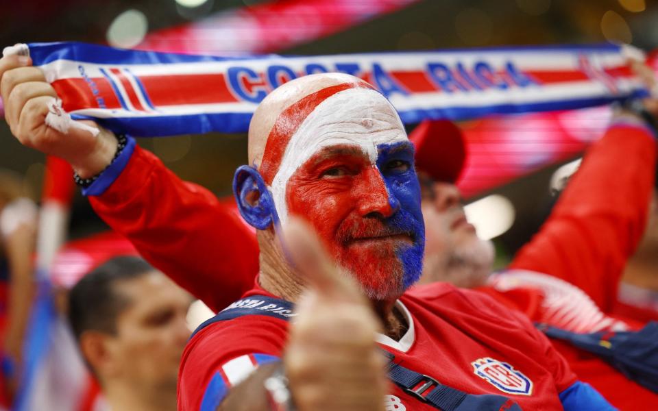A Costa Rica fan is pictured with face paint inside the stadium before the match - Kai Pfaffenbach/Reuters