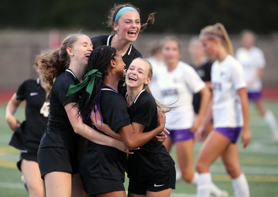Klahowya’s Amira Lyons (center) is embraced by Peyton Leifeste, Addyson Dickey and Kelsey Clark, after Amira’s goal put the Eagles up 5-4 for the win over North Kitsap in Silverdale on Tuesday, Sept. 5, 2023.