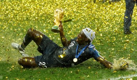 Soccer Football - World Cup - Final - France v Croatia - Luzhniki Stadium, Moscow, Russia - July 15, 2018 France's Benjamin Mendy celebrates with the trophy after winning the World Cup REUTERS/Kai Pfaffenbach