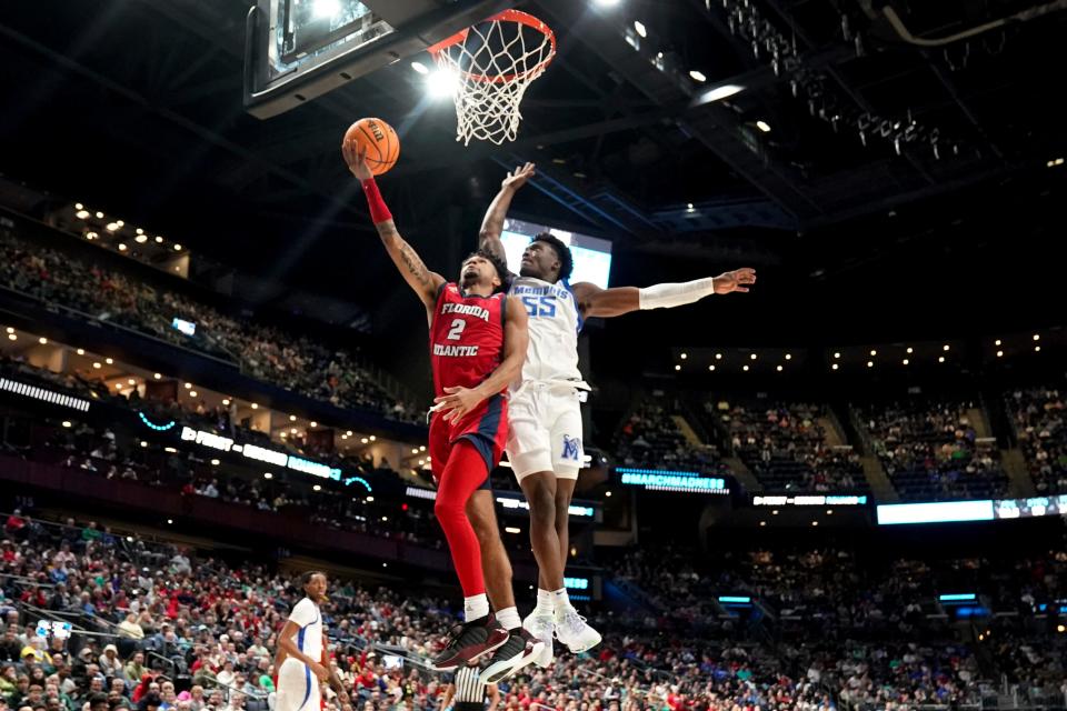 Florida Atlantic guard Nicholas Boyd (2) drives on Memphis Tigers guard Damaria Franklin (55) in the first half of a first-round college basketball game in the NCAA Tournament Friday, March 17, 2023, in Columbus, Ohio. (AP Photo/Paul Sancya)