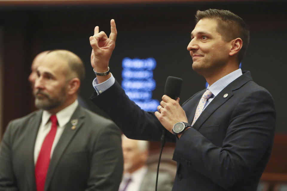 Sen. Danny Burgess, R-Zephyrhills, gestures as he recognizes University of South Florida students and their mascot, Rocky the Bull, in the gallery on Wednesday, Feb. 8, 2023 at the Capitol in Tallahassee, Fla. (AP Photo/Phil Sears)