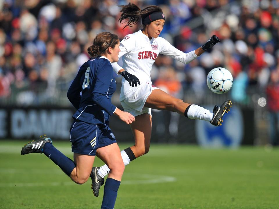 Christen Press controls the ball for Stanford.