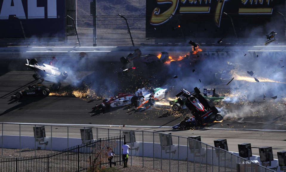 LAS VEGAS - SEPTEMBER 16: The car of Dan Wheldon driver of the #77 Bowers & Wilkins Sam Schmidt Motorsports Dallara Honda (top left) bursts into flames in a 15 car pile up including the #12 Team Penske Dallara Honda of Will Power during the Las Vegas Indy 300 part of the IZOD IndyCar World Championships presented by Honda on September 16, 2011 at the Las Vegas Motor Speedway in Las Vegas, Nevada. (Photo by Robert Laberge/Getty Images)