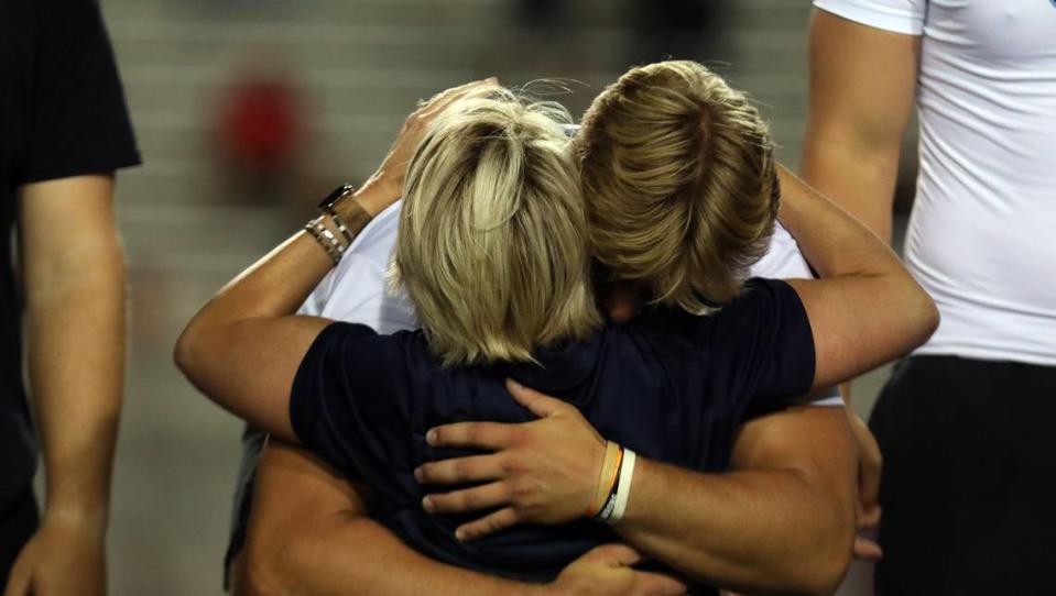 Clovis North junior McKay Madsen gets a hug -- and the shot put gold medal -- at the 2024 CIF Track and Field Championships at Buchanan High (Clovis) on May 25, 2024. Madsen added the shot put title with a toss of 62 feet, 9 1/2 inches to edge senior teammate Brayden Bitter’s 62-02 1/2 toss.