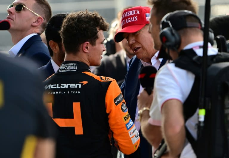 McLaren's British driver Lando Norris is congratulated by former US President and 2024 presidential candidate Donald Trump after winning the 2024 Miami Grand Prix. (GIORGIO VIERA)