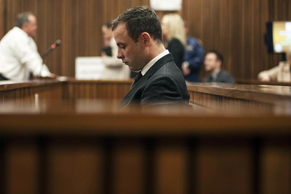South African Olympic and Paralympic athlete Oscar Pistorius sits in the dock during his murder trial in the North Gauteng High Court in Pretoria June 30, 2014. Pistorius is on trial for murdering his girlfriend Reeva Steenkamp at his suburban Pretoria home on Valentine's Day last year. REUTERS/Ihsaan Haffejee/Pool