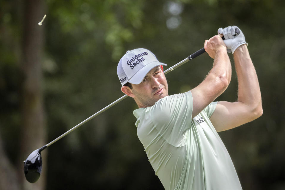 Patrick Cantlay watches his drive down the ninth fairway during the third round of the RBC Heritage golf tournament, Saturday, April 16, 2022, in Hilton Head Island, S.C. (AP Photo/Stephen B. Morton)