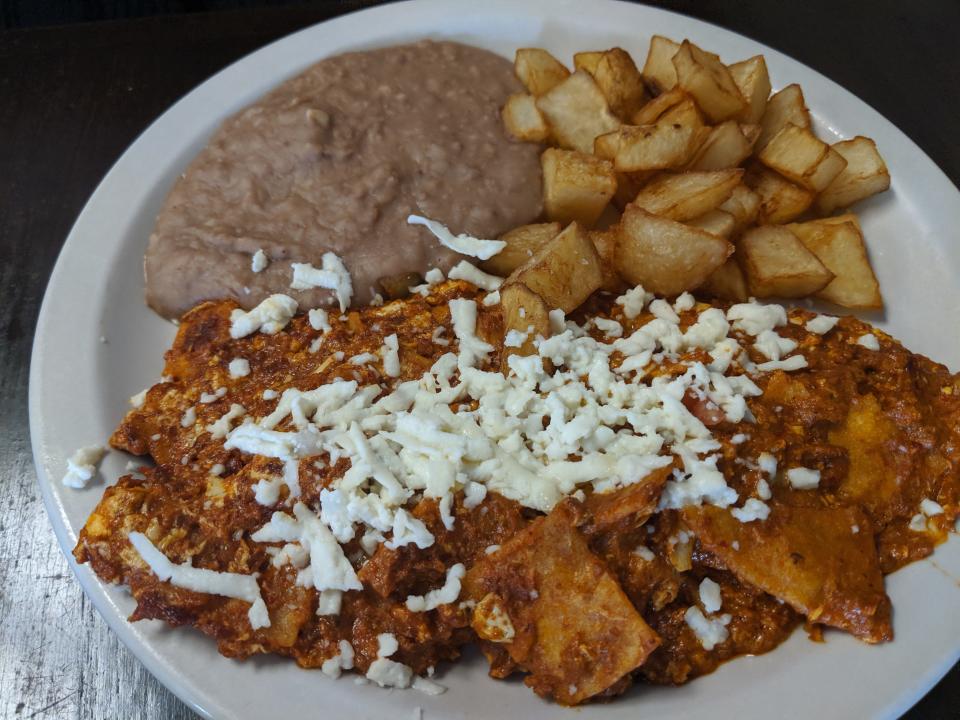 Chilaquiles, scrambled eggs mixed with corn tortillas, jack cheese, salsa and added chorizo (USAT photo)