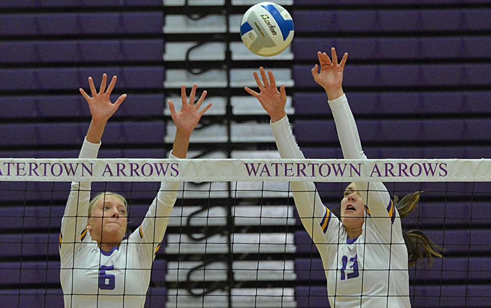 Watertown's Eve Hauger and Carer Jurrens (13) go up for the block during an Eastern South Dakota Conference volleyball match against Mitchell on Thursday, Sept. 21, 2023 in the Watertown Civic Arena.