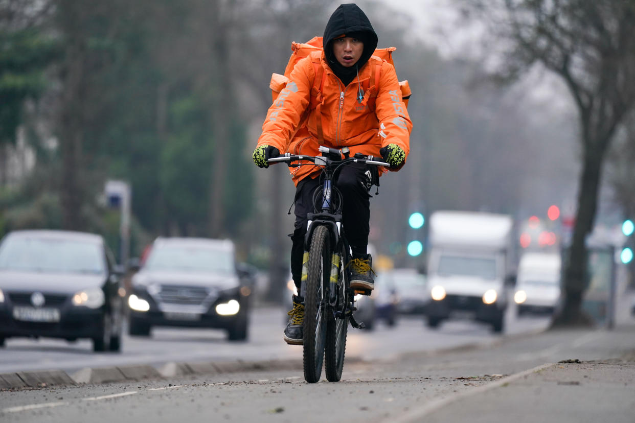 A woman rides along a cycle lane next to heavy traffic in Birmingham. The Highway Code is due to be updated on January 29, pending parliamentary approval, to introduce a risk-based hierarchy of road users. Someone driving will have more responsibility to watch out for people cycling, walking or riding a horse, and cyclists will have more responsibility to be aware of pedestrians. Picture date: Tuesday January 25, 2022.