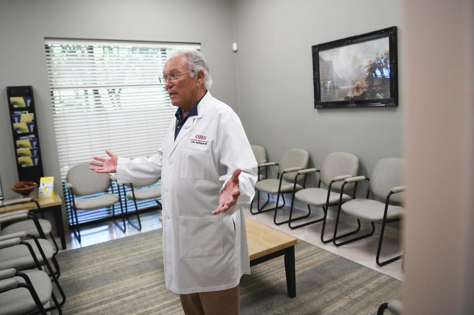 Dr. John McElligott shows an area of his office, Friday, July 15, 2022. McElligott is receiving the Health Care Heroes Lifetime Achievement award. 