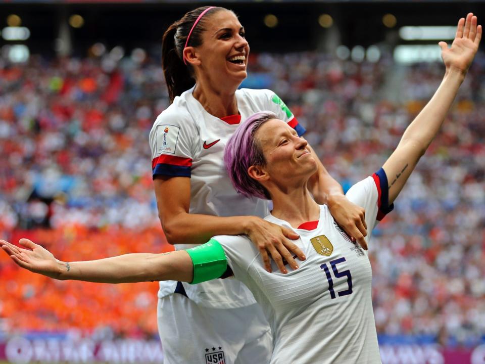 Megan Rapinoe and Alex Morgan celebrate a goal during the 2019 World Cup.