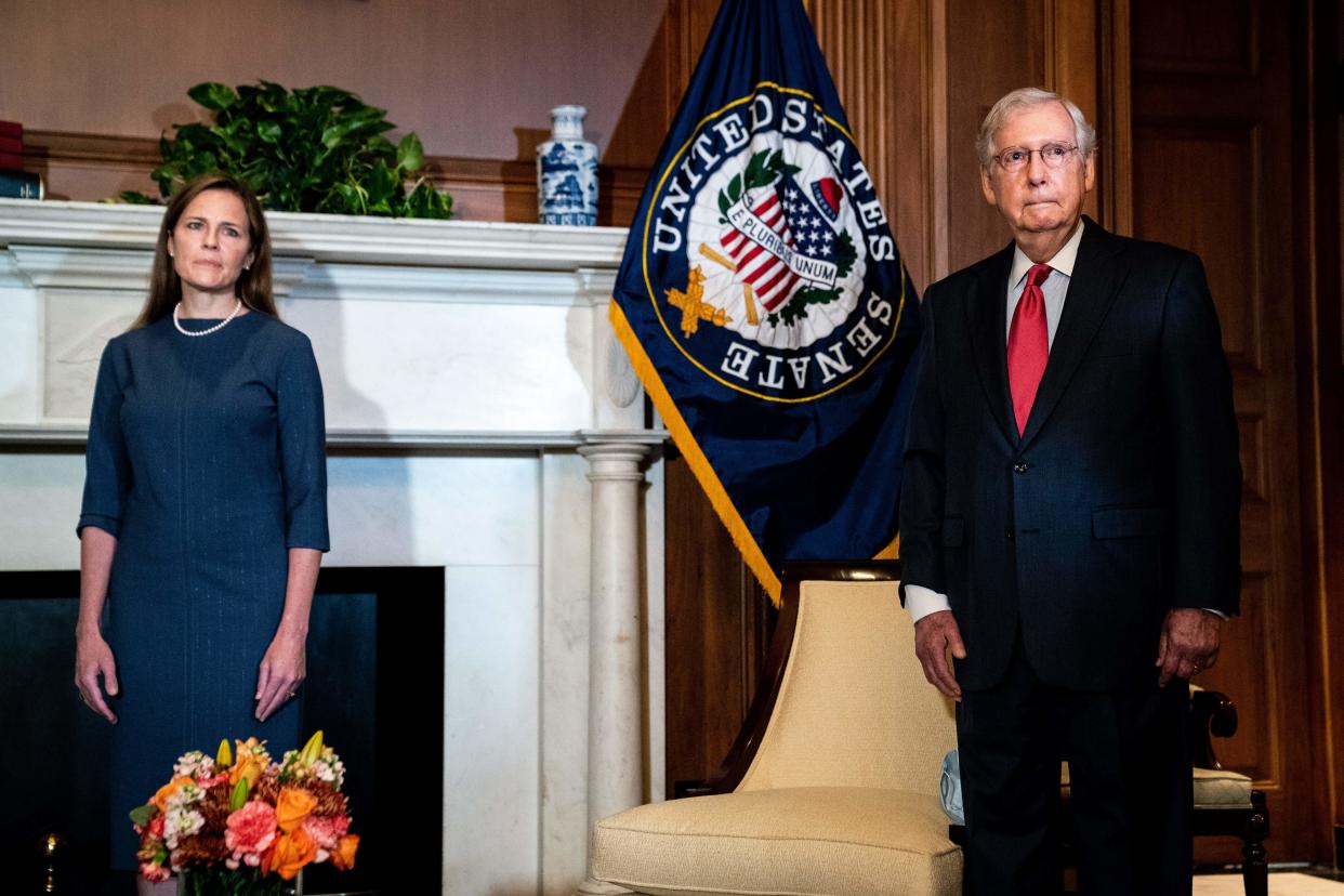 Mitch McConnell helped Judge Amy Coney Barrett avoid reporter questions when meeting on Capitol Hill on Tuesday (POOL/AFP via Getty Images)