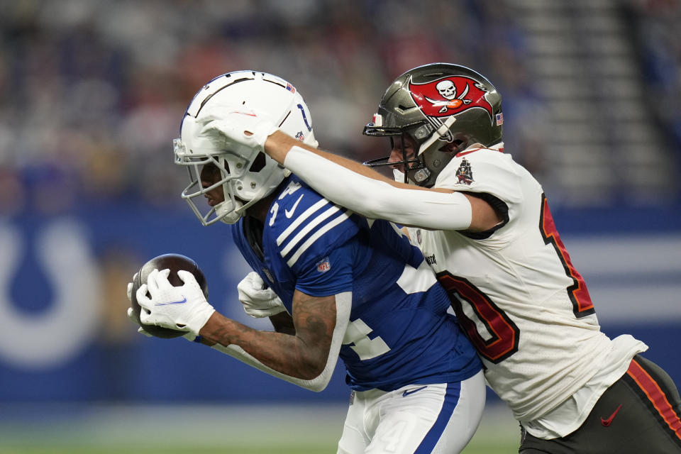 Indianapolis Colts' Isaiah Rodgers (34) makes an interception against Tampa Bay Buccaneers' Scott Miller (10) during the first half of an NFL football game, Sunday, Nov. 28, 2021, in Indianapolis. (AP Photo/AJ Mast)