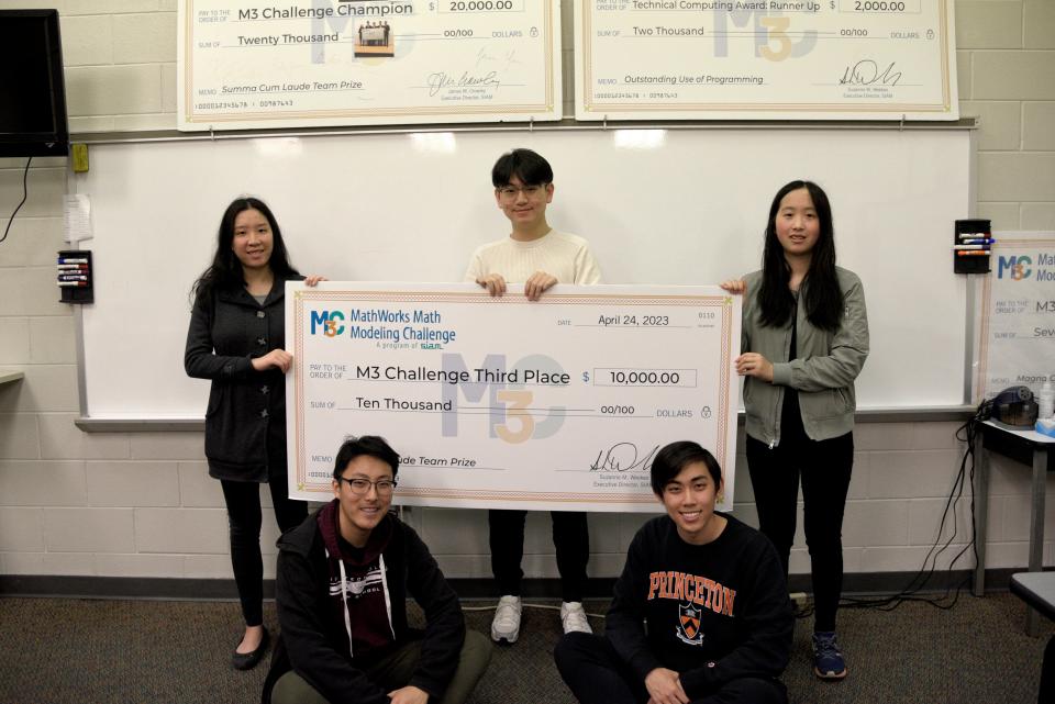 From top left: Amanda Lin, Michael Gao, Amanda Guan, Kevin Liu, Kevin Guan. Students from High Technology High School pose with a $10,000 check on Friday, April 27, 2023 at High Technology High School in Middletown, New Jersey. They placed third in the M3 Challenge.