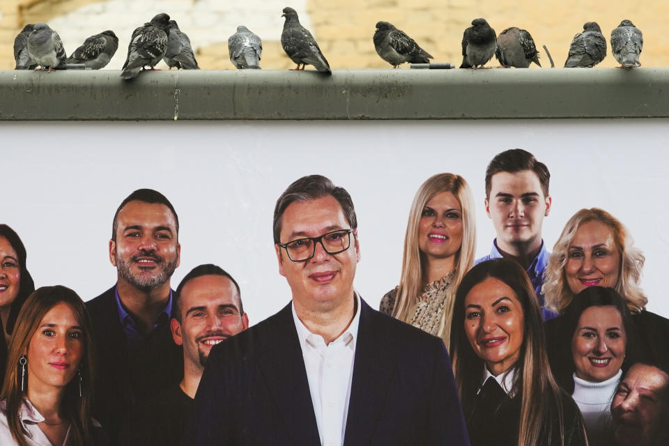 Pigeons stand on a pre-election billboard showing Serbian President Aleksandar Vucic with members of his ruling Serbian Progressive Party in Belgrade, Serbia, Wednesday, Dec. 6, 2023. When Serbia formally opened membership negotiations with the European Union, back in 2014, it was a moment of hope for pro-Western Serbs, eager to set their troubled country on an irreversible path to democratization. Those days are long gone. Now, they feel betrayed, both by the government and the EU. (AP Photo/Darko Vojinovic)