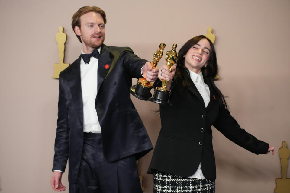 HOLLYWOOD, CALIFORNIA - MARCH 10: (L-R) Finneas O'Connell and Billie Eilish onstage in the press room at the 96th Annual Academy Awards at Ovation Hollywood on March 10, 2024 in Hollywood, California. (Photo by Jeff Kravitz/FilmMagic)