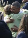 U.S. President Barack Obama hugs Jane Mullen, wife of former chairman of the Joint Chiefs of Staff Admiral Mike Mullen, at an event commemorating the 12th anniversary of the 9/11 attacks, at the Pentagon near Washington September 11, 2013. (REUTERS/Jason Reed)