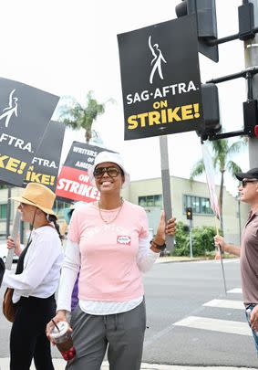 As such, plenty of famous faces have joined the picket lines in New York and Los Angeles recently. Aisha Tyler: