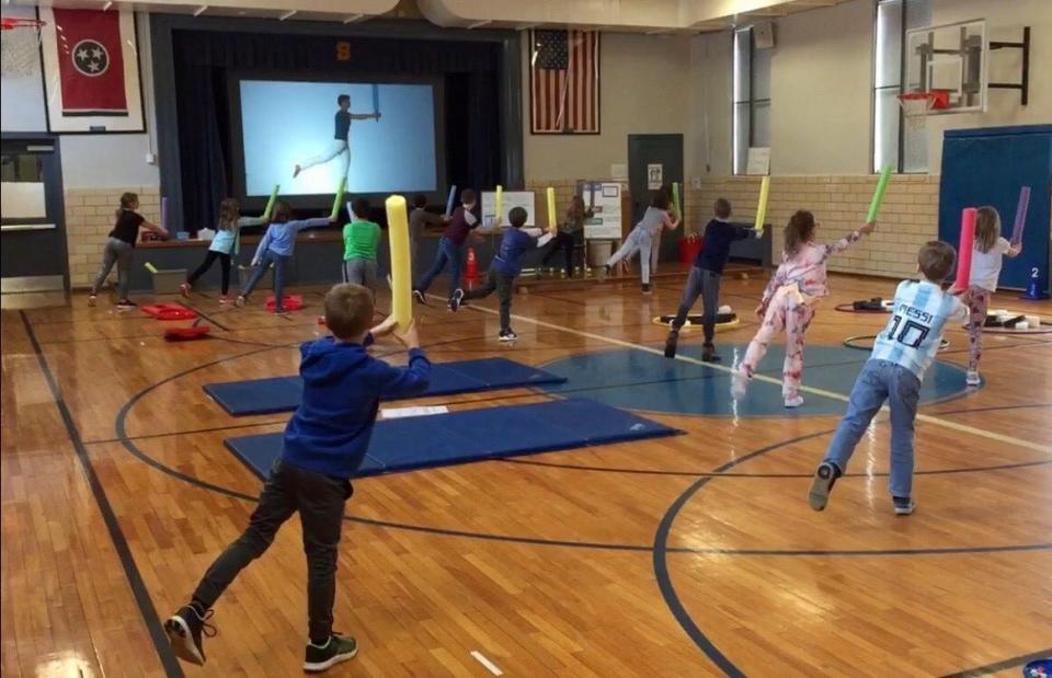 Second grade students at Sequoyah Elementary are shown practicing Jedi balance exercises during a physical education class of the 2019-20 school year.