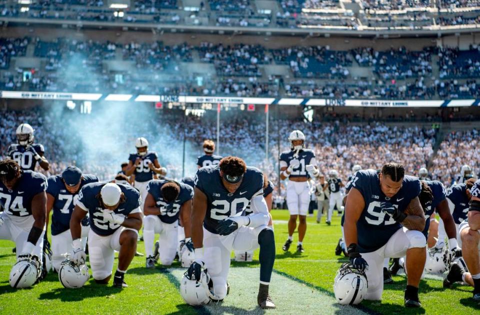 Penn State defensive end Adisa Isaac, 20, and his fellow teammates take a moment in the end zone before the game against Central Michigan on Saturday, Sept. 24, 2022.