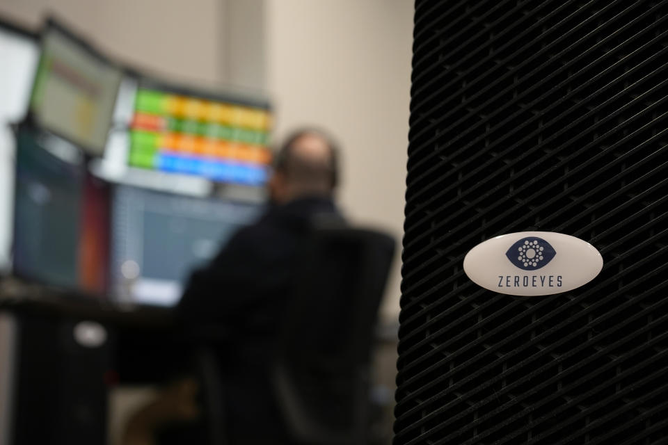 A ZeroEyes analyst monitors alerts at the company's operations center, Friday, May 10, 2024, in Conshohocken, Pa. (AP Photo/Matt Slocum)