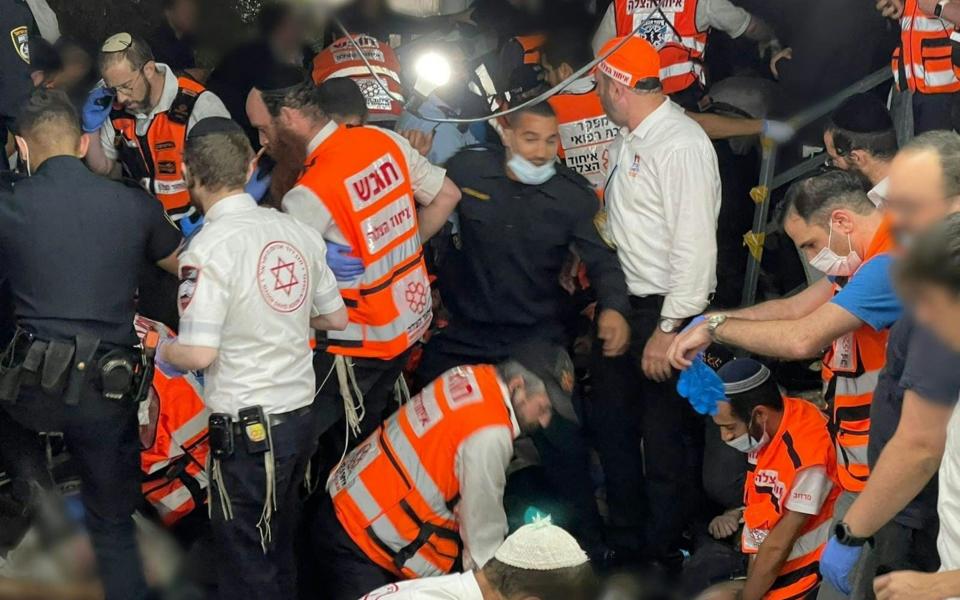 Emergency personnel assisting people after after dozens of people were killed and others injured  - AFP