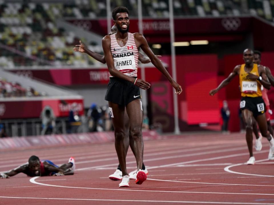 Canada's Moh Ahmed, middle, seen during the Tokyo Games in 2021, will compete in the men’s 5,000m final scheduled for Sunday, the final night of competition at the World Athletics Championships. (The Canadian Press - image credit)