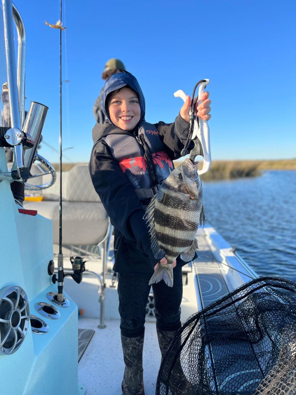 Chris Windham took a quick trip after church to the St. Marks river with family and friend Micah Roberts. Micah holds up a nice sheepshead, one of many fish caught! Chris Windham photo
