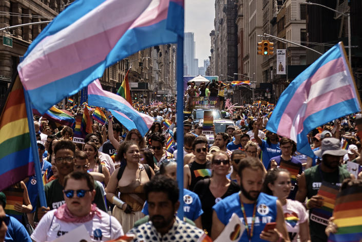 FILE - Revelers march during the New York City Pride Parade on Sunday, June 24, 2018, in New York. Parades celebrating LGBTQ pride kick off in some of America's biggest cities Sunday amid new fears about the potential erosion of freedoms won through decades of activism. The annual marches in New York, San Francisco, Chicago and elsewhere take place just two days after one conservative justice on the Supreme Court signaled, in a ruling on abortion, that the court should reconsider the right to same-sex marriage recognized in 2015. (AP Photo/Andres Kudacki, File)