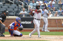 Atlanta Braves right fielder Abraham Almonte (34) follows through on a home run against the New York Mets during the fourth inning of a baseball game Thursday, July 29, 2021, in New York. (AP Photo/Noah K. Murray)
