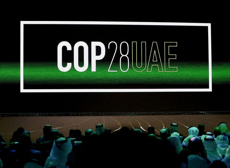 FILE PHOTO: 'COP28 UAE' logo is displayed on the screen during the opening ceremony of Abu Dhabi Sustainability Week (ADSW) under the theme of 'United on Climate Action Toward COP28', in Abu Dhabi