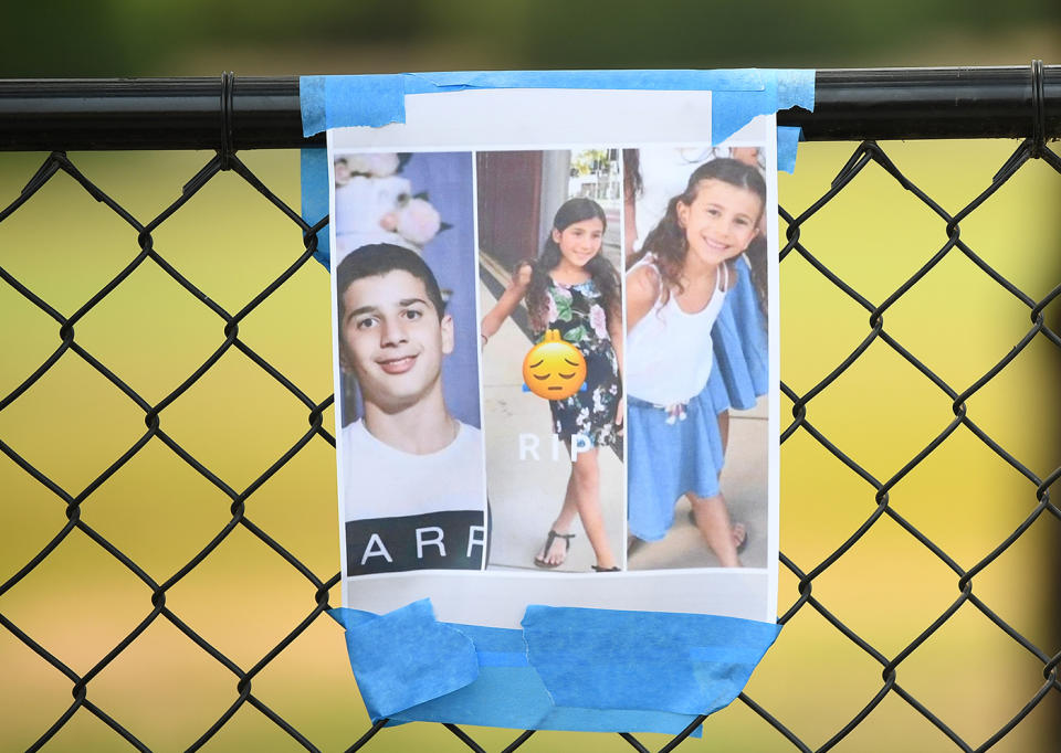 A picture showing victims amoung flowers placed at the scene where seven children were hit on a footpath by a four-wheel drive in the Sydney suburb of Oatlands, Sunday, February 2, 2020. Four children have died and a fifth is in a critical condition after they were hit by a four-wheel drive while on the footpath in Sydney's northwest. (AAP Image/Joel Carrett) NO ARCHIVING