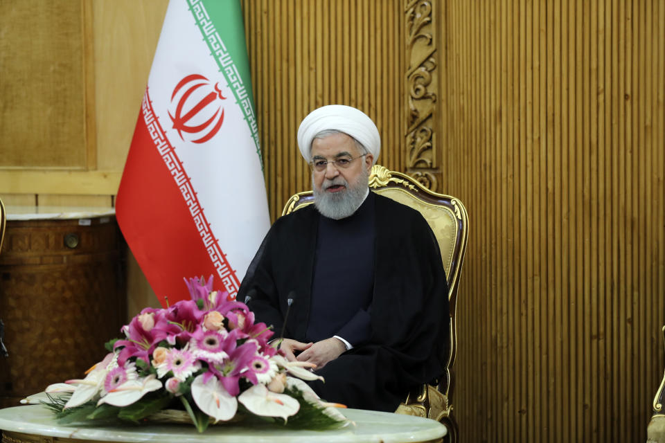 In this photo released by official website of the office of the Iranian Presidency, President Hassan Rouhani speaks at Mehrabad airport, in Tehran, Iran, Thursday, Sept. 27, 2018, on arrival from New York after attending the United Nations General Assembly. Rouhani said Thursday that the U.N. Security Council meeting chaired by President Donald Trump the previous day reflected America's increasing isolation among the international community. (Iranian Presidency Office via AP)