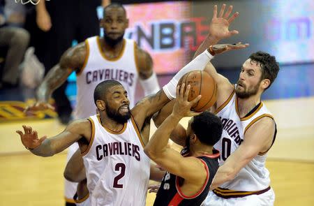 May 17, 2016; Cleveland, OH, USA; Cleveland Cavaliers guard Kyrie Irving (2) and forward Kevin Love (0) defend Toronto Raptors guard Cory Joseph (6) in the third quarter in game one of the Eastern conference finals of the NBA Playoffs at Quicken Loans Arena. Mandatory Credit: David Richard-USA TODAY Sports