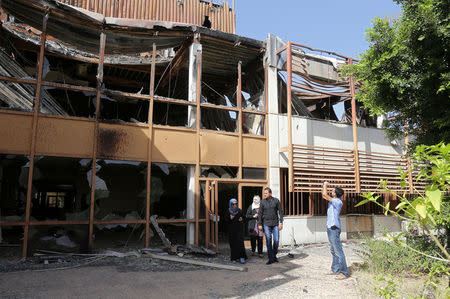 Libyans visit the destroyed headquarters of Benghazi University, in Benghazi, Libya, October 27, 2016. EUTERS/Esam Omran Al-Fetori