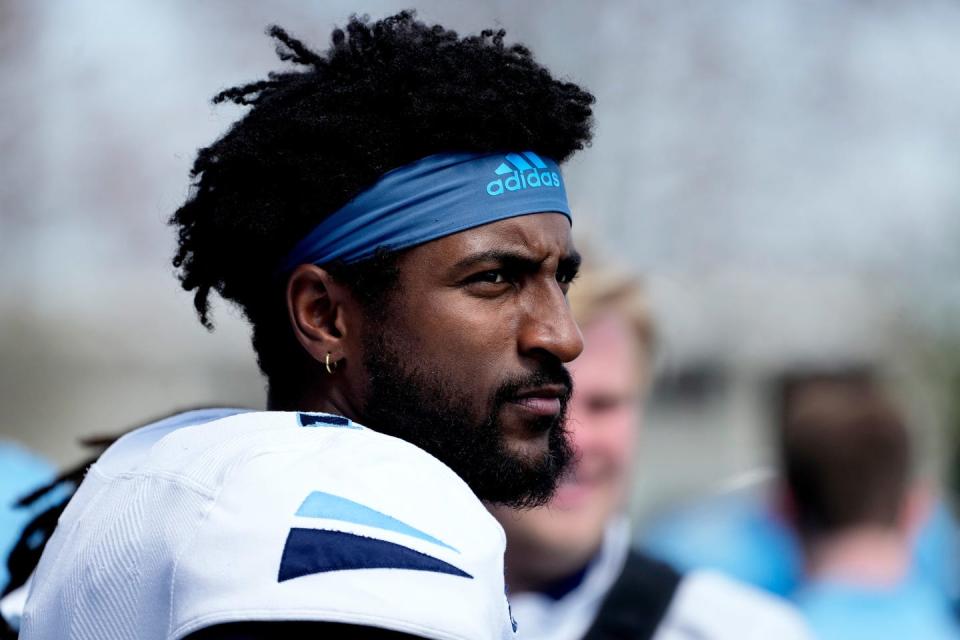 URI quarterback Kasim Hill watches from the sidelines as teammates play in their annual Blue-White game.