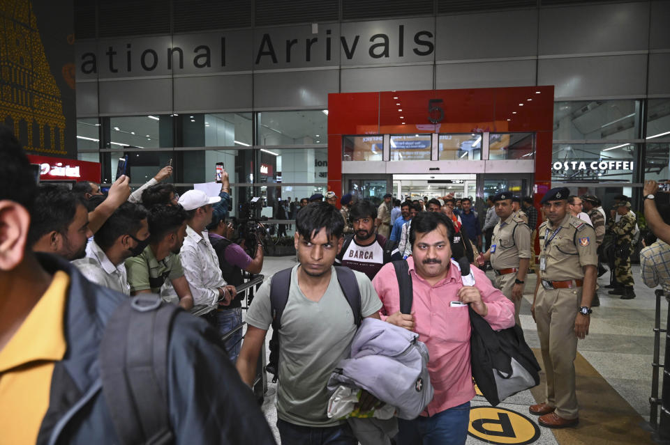 Indians evacuated from Sudan arrive on a flight at the Indira Gandhi International Airport in New Delhi, India, Wednesday, April 26, 2023. (AP Photo)