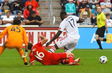 Jul 21, 2018; Chicago, IL, USA; Chicago Fire defender Jonathan Campbell (16) knocks the ball away from Toronto FC forward Jozy Altidore (17) during the second half at Bridgeview Stadium. Mandatory Credit: Mike DiNovo-USA TODAY Sports