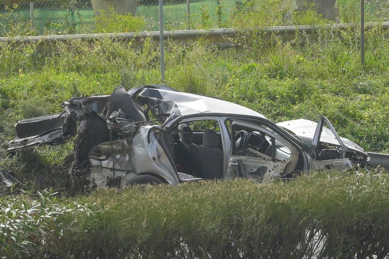A view of a destroyed vehicle at the accident scene. Two police officers and four others died when they were hit by a speeding truck which went through a police checkpoint on a motorway near Seville in southern Spain on Tuesday. Francisco J. Olmo/EUROPA PRESS/dpa
