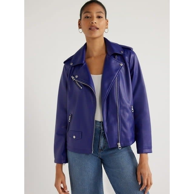 model in a trendy purple leather jacket and blue jeans