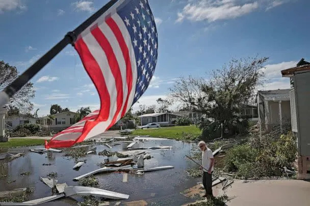 PHOTO: A man begins cleaning up after Hurricane Ian moved through the Gulf Coast of Florida on Sept. 29, 2022 in Punta Gorda, Fla. (Win Mcnamee/Getty Images)