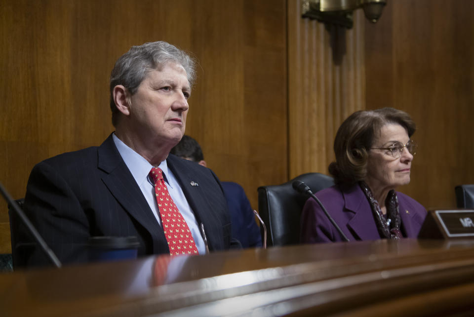 Sen. John Kennedy, R-La., left, and Sen. Dianne Feinstein, D-Calif., listen to testimony as the Senate Judiciary Committee during a hearing to examine China's non-traditional espionage against the United States, on Capitol Hill in Washington, Wednesday, Dec. 12, 2018. (AP Photo/J. Scott Applewhite)