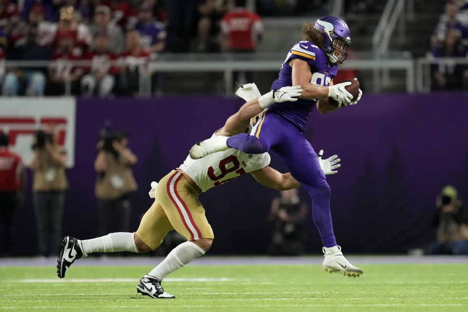 Minnesota Vikings tight end T.J. Hockenson is tackled by San Francisco 49ers defensive end Nick Bosa (97) after catching a pass during the second half of an NFL football game, Monday, Oct. 23, 2023, in Minneapolis. (AP Photo/Abbie Parr)