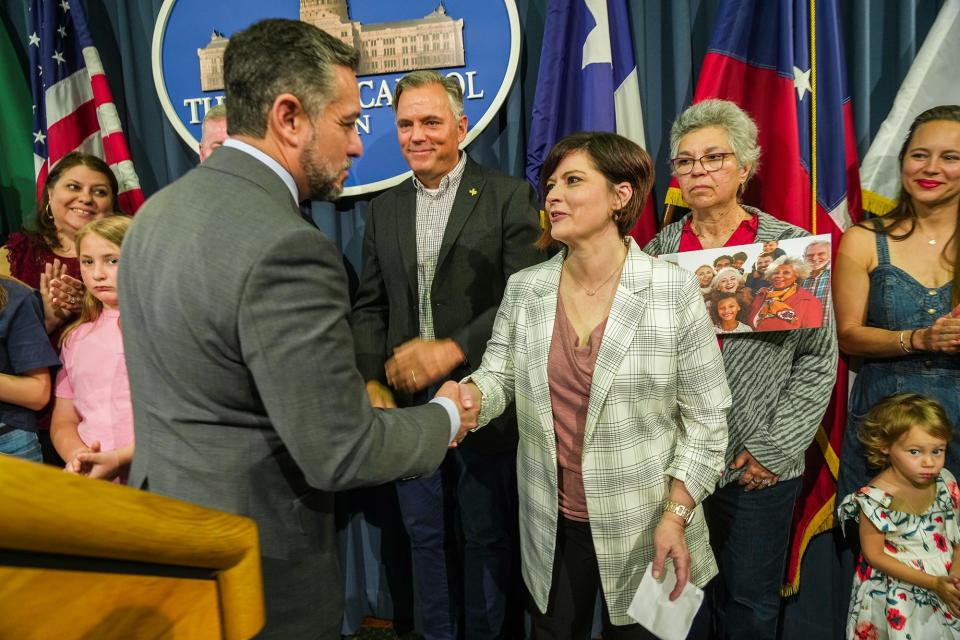 Sen. César Blanco shakes Charity Davis' hand after his news conference on Senate Bill 29 on nurse practitioners. Charity Davis credits a nurse practitioner with saving her life from cancer.