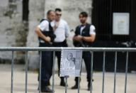 Security personnel pictured outside a church in Saint-Etienne-du-Rouvray, where French priest Jacques Hamel was murdered in a jihadist attack