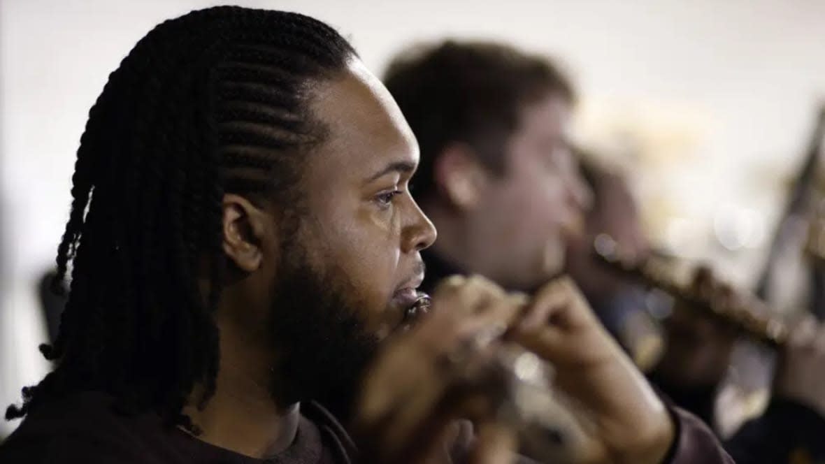 Deronne White, 25, plays his flute while taking part in a rehearsal with the Brixton Chamber Orchestra for pending coronation performances in London. In south London’s Brixton, musicians plan to parade through the streets entertaining crowds with a carnival set mix of gospel, jazz, grime, disco and rap. (Photo: David Cliff/AP)