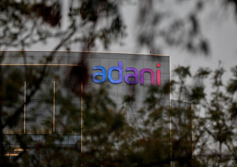 FILE PHOTO: The logo of the Adani Group is seen on the facade of its Corporate House on the outskirts of Ahmedabad