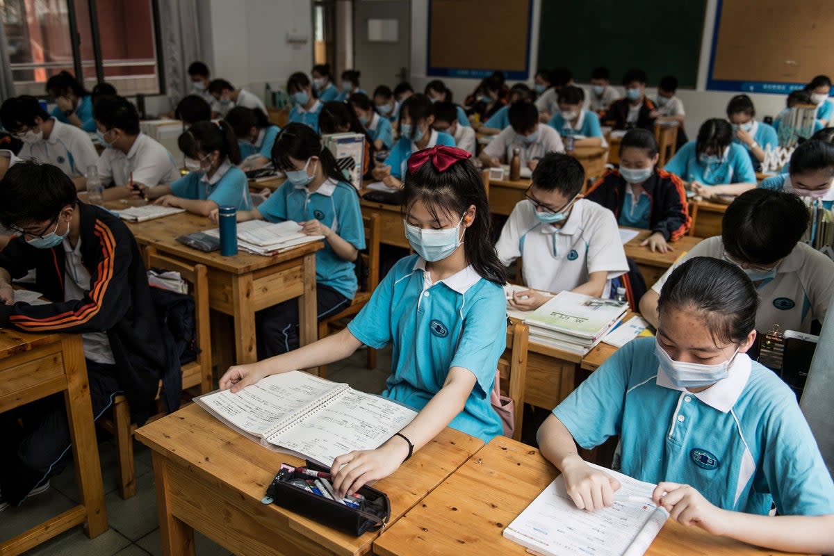 Representational image: Eighth grade history book has included China’s ‘war’ on Covid  (AFP via Getty Images)